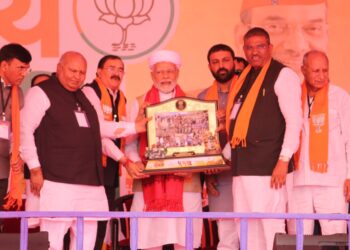 Upcoming Dhaman Gujarati movie's producer Bhupat Bodar presents memento to PM Modi behalf of his Dhaman team 